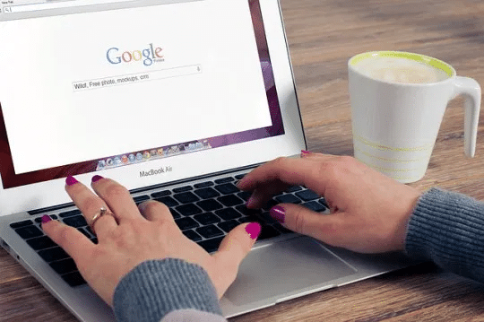 girl with coffee and laptop